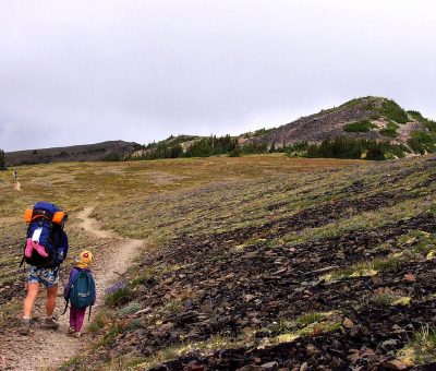 Hiker with backpack on backcountry trail